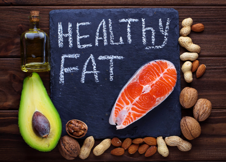 image of healthy fats foods including salmon and high protein on the table.