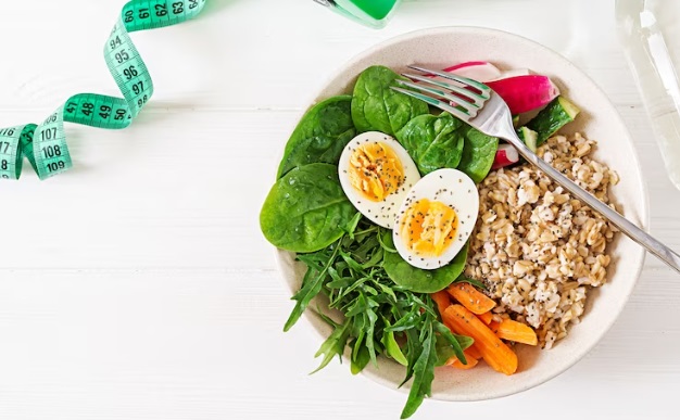 a plate with eggs carrot oats a nutrition full breakfast on table